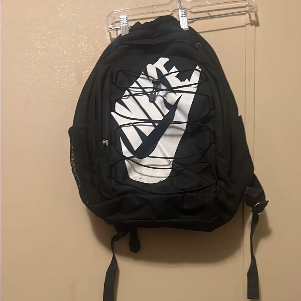 Nike Black and White Backpack with Bold Swoosh Design